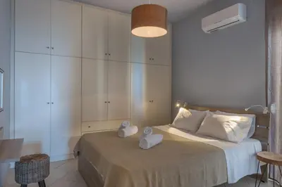 a bedroom with a bed with two towels on it at Nais Apartments & Studios in Chania Town