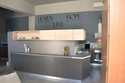 a kitchen with a sink and a counter top at Evaris Apartments in Chania Town