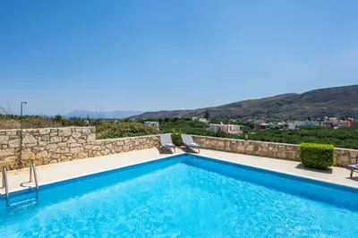a villa with a swimming pool with a view at Adam Villas in Falasarna