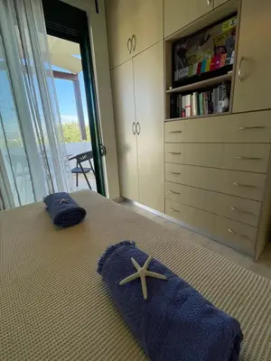 a bedroom with a bed with a starfish on it at Sunny Villa in Kissamos