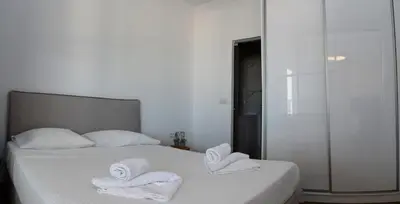 a bedroom with two white towels on a bed at Urban 35 in Chania Town