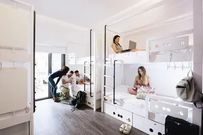 a group of people in bunk beds in a room at Cocoon City Hostel in Chania Town
