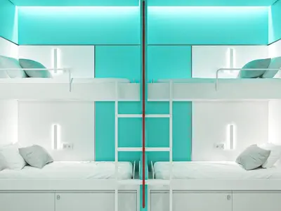 a room with two bunk beds with blue walls at Cocoon City Hostel in Chania Town