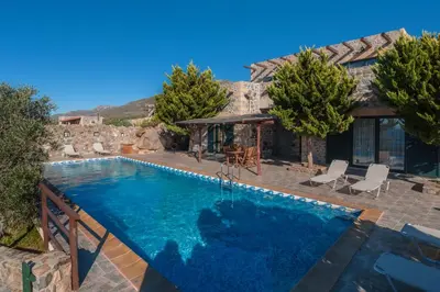 a villa with a swimming pool and a house at Sea-Sunset Views Villa Lefkothea with Private Pool near Elafonissi in AmigdhalokeFálion