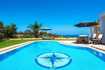 a swimming pool with a starfish in the middle at Nikola's Villa Stalos Chania in Stalos