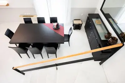 a dining room with a black table and chairs at Villa Giota in Chania Town