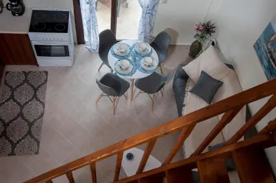 an overhead view of a table and chairs in a living room at Kyriaki's Cozy Apartments in Agia Marina Nea Kydonias