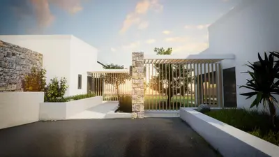 a white house with a gate in a yard at Iskios Villas in Agia Marina Nea Kydonias