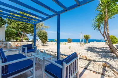 a view of the beach from the patio of a villa at Villa Blanca Collection in Kalathas
