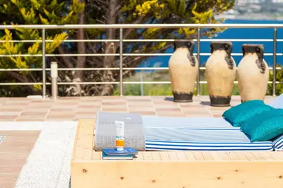 a table with towels and napkins on top of a pool at Villa Blanca Collection in Kalathas