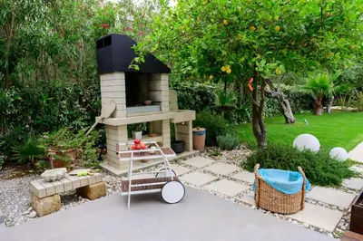 a garden with a brick oven in a yard at Elia Seaside Villa, Amazing 2-Story Eco Pool House! in Kissamos