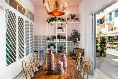 a dining room with a wooden table and chairs at Nyx Chic Manor in Chania Town