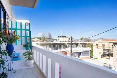 a balcony with a view of a city at Irini Apartment II in Kalyves