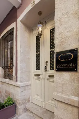 a door to a house with a sign on it at Consolato Boutique in Chania Town