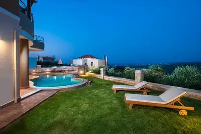 a backyard of a house with a swimming pool at Villa Stellina in Marathokefála