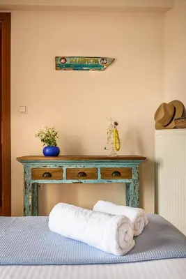 a table with a bed with towels on it at Platanias Sky View in Plataniás