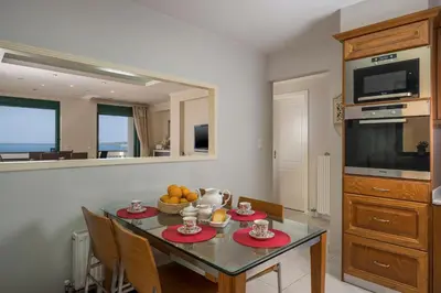 a dining room with a table with fruit on it at Vaggelio House in Chania Town