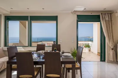 a dining room with a table and chairs at Vaggelio House in Chania Town