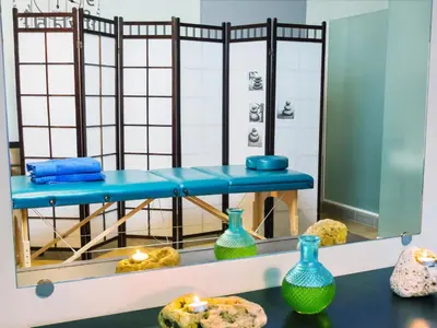 a room with blue and green vases on a table at Christina Beach Hotel in Chania Town