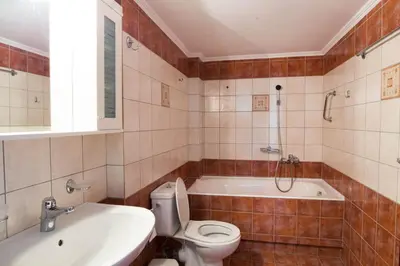 a bathroom with a toilet and a tub and a sink at Chania Sea View Apartment with Free Private Parking in Chania Town