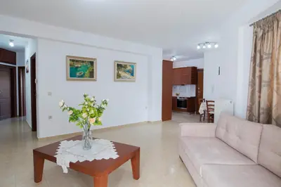 a living room with a couch and a table at Chania Sea View Apartment with Free Private Parking in Chania Town