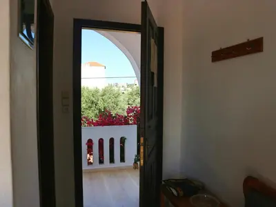 an open door to a room with a view at Oliaria Apartments in Plataniás