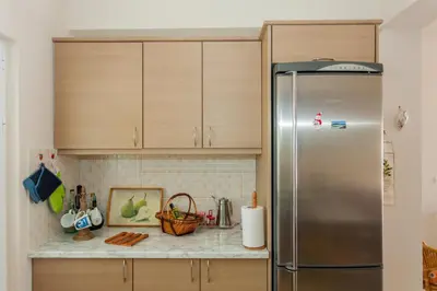 a kitchen with a stainless steel refrigerator at Villa Nopigia Somina in Kissamos