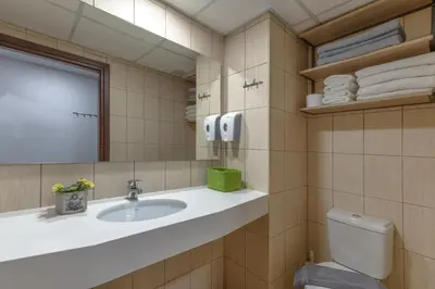 a bathroom with a sink and a toilet at Stefan's City Hub in Chania Town