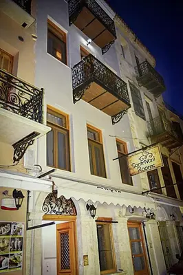 a building with windows and balconies on it at Santrivani Rooms in Chania Town