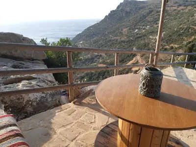 a coffee mug sitting on a table on top of a mountain at Fudulis Villa in Ravdhoúkha