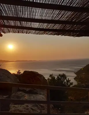 a sunset over the ocean from a house at Fudulis Villa in Ravdhoúkha