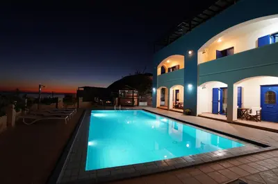 a swimming pool in front of a house at night at Sfakian Horizon in Khóra Sfakíon