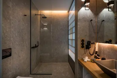 a bathroom with a shower and a sink at Scala de Faro in Chania Town