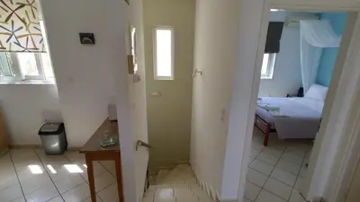 a small room with a bed and a bedroom at Blue Villas in Agia Marina Nea Kydonias