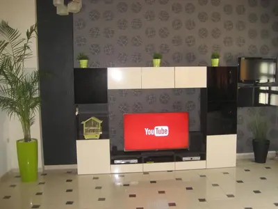 a tv on a stand with a tv on it at Mythos- Platanias- Hotel -Apts in Plataniás