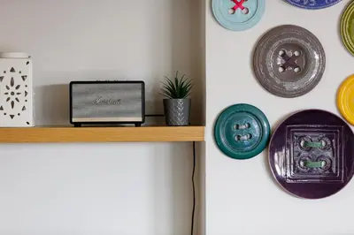 a shelf with a laptop and plates on a wall at Villa Veni in Kolymvari
