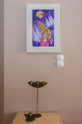 a picture of a girl with a kite on a wall at Spolia Art Maison in Chania Town