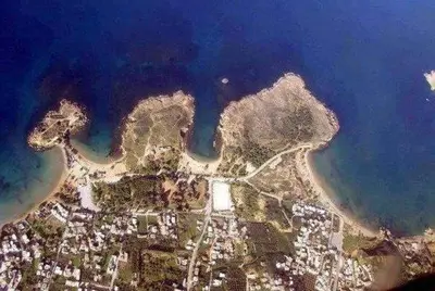 an aerial view of an island in the water at Niriis Hotel in Kato Daratso