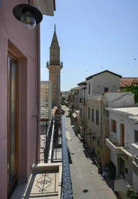a view from the balcony of a building with a tower at Minaret Suites and Apartments in Chania Town