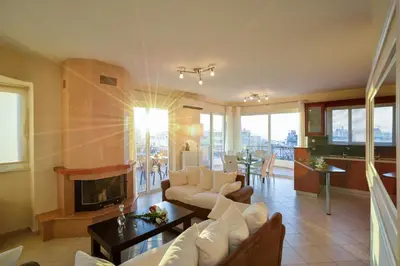 a living room with a couch and a fireplace at Elia Selinou in Chania Town