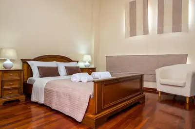 a bedroom with a bed with two towels on it at Villa AERAS in Kato Daratso