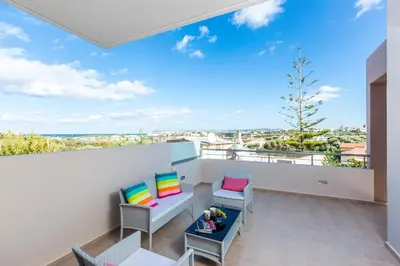 a balcony with a view of the ocean at Peris Villa in Kato Daratso