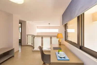 a dining room with a table and a chair at Peris Villa in Kato Daratso
