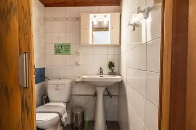 a small bathroom with a toilet and a sink at Villa Venezia in Chania Town