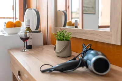 a bottle of wine and a glass on a counter at Villa Venezia in Chania Town