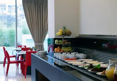a buffet line with plates of food in a restaurant at Samaria Hotel in Chania Town