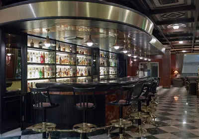 a bar with a bunch of bar stools at Samaria Hotel in Chania Town