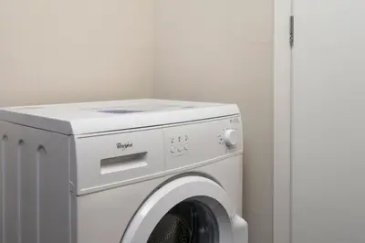 a white washer and dryer in a room at Spring Apartments in Chania Town
