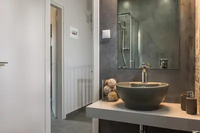 a bathroom with a bowl sink and a mirror at Casa Giulietta Modern Luxury Maisonette in Chania Town