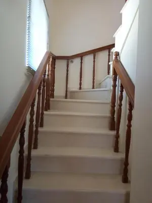 a set of stairs with a window and a stair case at Beachway home in Kato Daratso